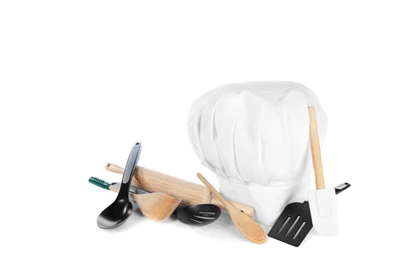 Chef's hat with cooking utensils — Stock Photo, Image