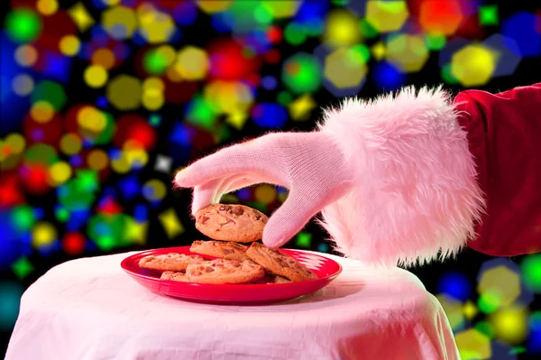 Santa, αρπάζοντας ένα cookie — Φωτογραφία Αρχείου