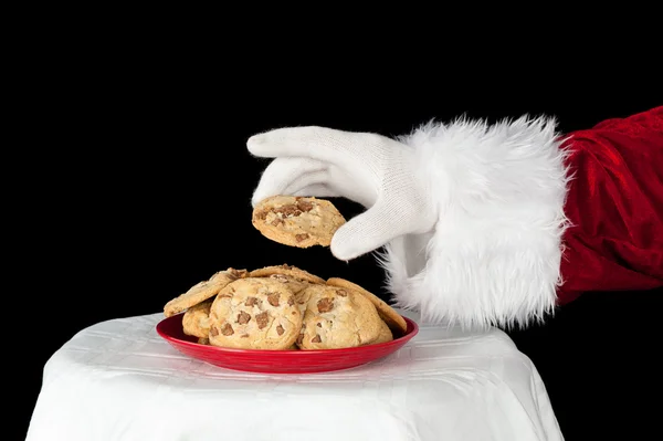 Père Noël attrapant un cookie — Photo