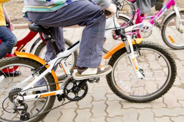 Children riding bike clipart