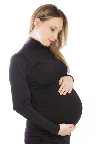 Έγκυος γυναίκα σε ένα μαύρο φόρεμα κρυψίνους — Φωτογραφία Αρχείου