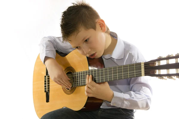 stock image Boy with an acoustic guitar isolated on white