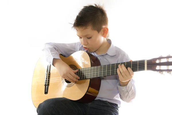 stock image Boy with an acoustic guitar isolated on white