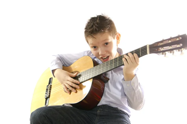 Boy with an acoustic guitar isolated on white — Stock Photo, Image