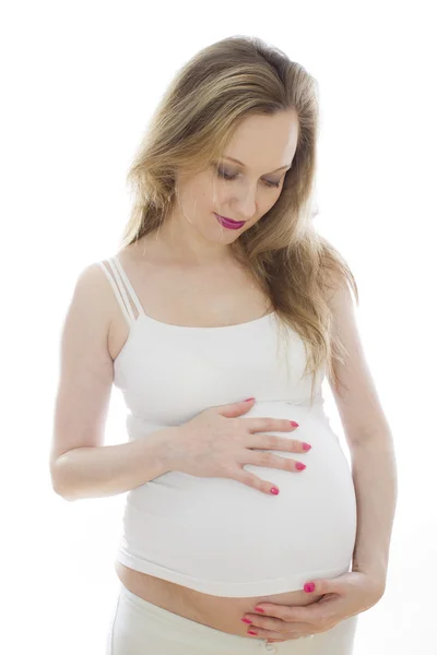 Femme enceinte en blanc — Photo