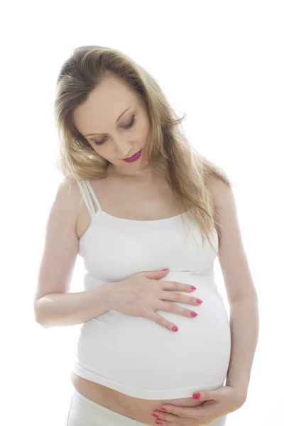 Pregnant woman in white — Stock Photo, Image