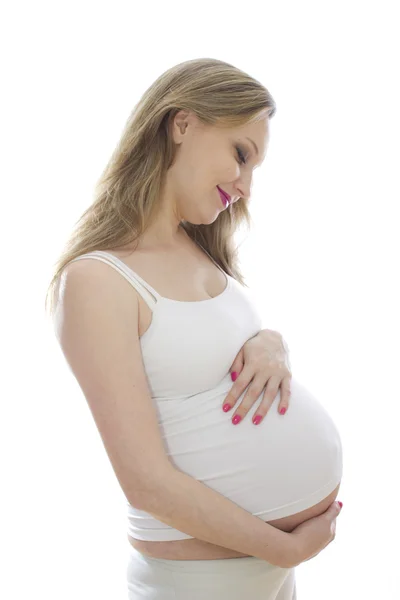 Kobieta w ciąży w biały — Zdjęcie stockowe