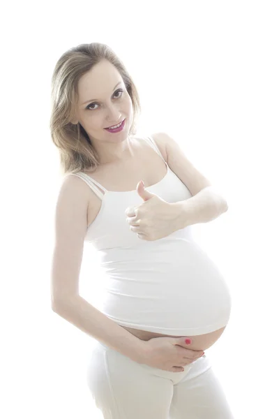 Femme enceinte en blanc — Photo