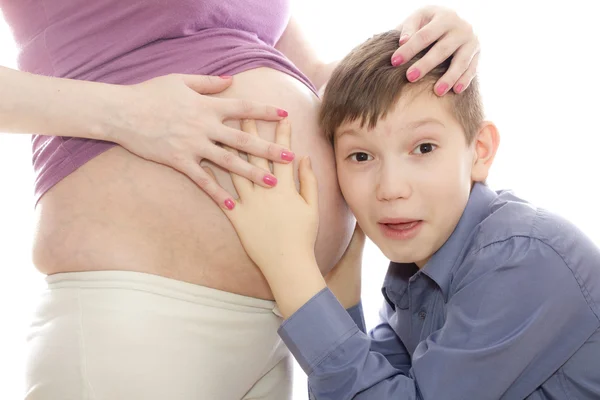 Frightened and astonished boy and a pregnant woman — Stock Photo, Image