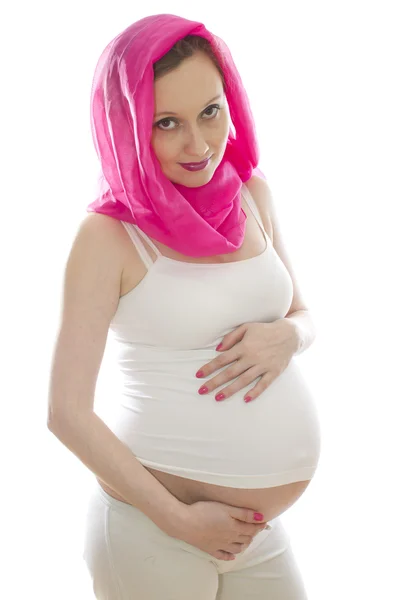 Terhes nő rózsaszín fejkendő — Stock Fotó