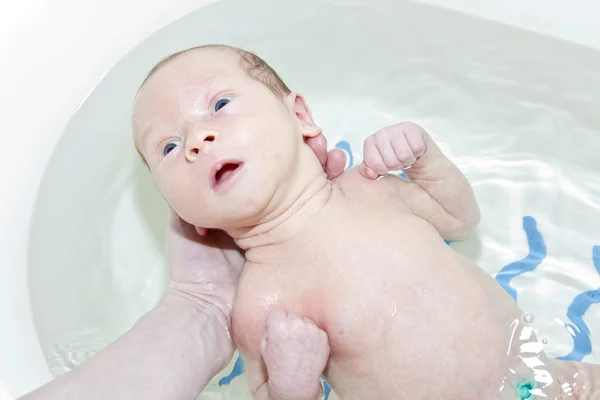 stock image Infant is bathed in the bath