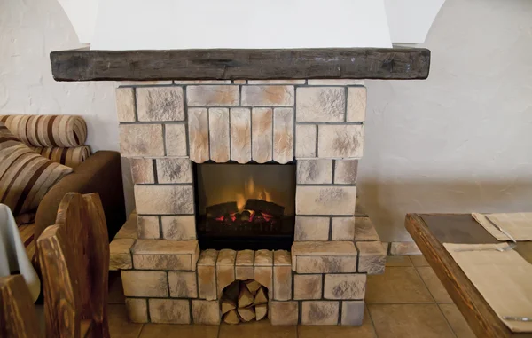 Stone fireplace in restaurant — Stock Photo, Image