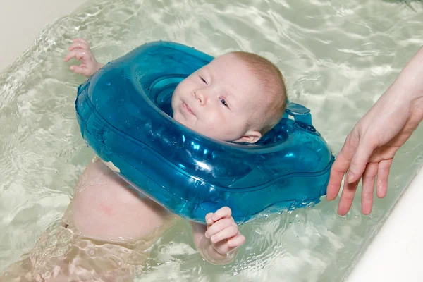Baby swimmer with rubber ring — Stock Photo, Image