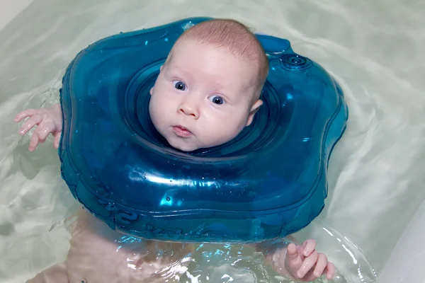 Baby swimmer with rubber ring — Stock Photo, Image