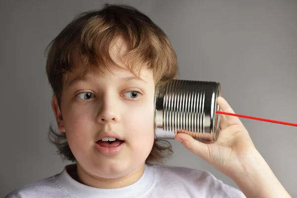 Beauty boy listen tin can telephone — Stock Photo, Image