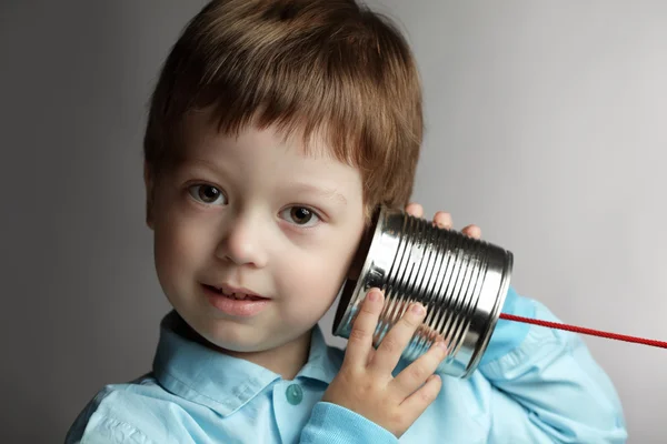 Beauty boy listen tin can telephone — Stock Photo, Image