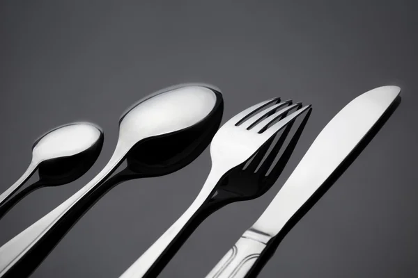 Fork and spoon on gray deck — Stock Photo, Image