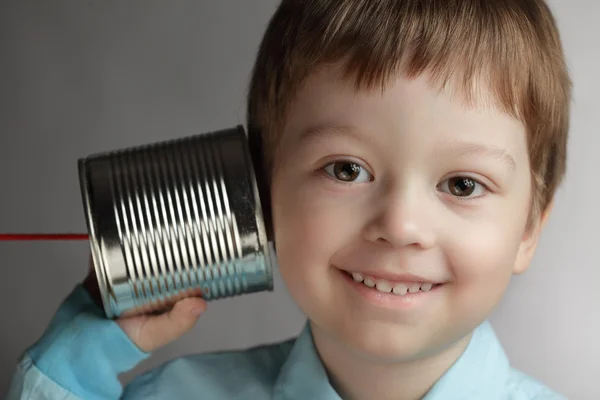Beauty boy listen tin can telephone — Stock Photo, Image