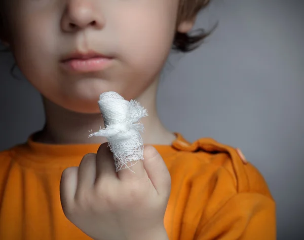 Boy with a wound on his finger — Stock Photo, Image