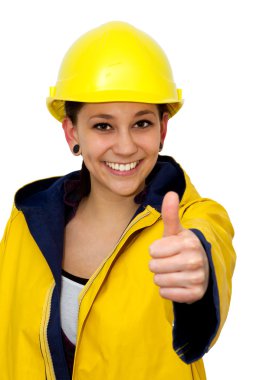 Young woman in workwear with thumb up clipart
