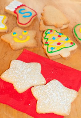 Colorful Christmas ookies on wooden tabletop clipart