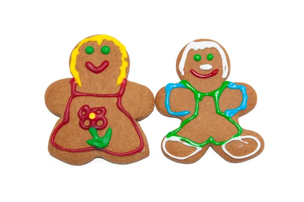 Colorful gingerbred man and woman on white — Stock Photo, Image