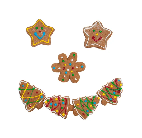 カラフルなクリスマス クッキー笑みを浮かべて顔を形成 — ストック写真
