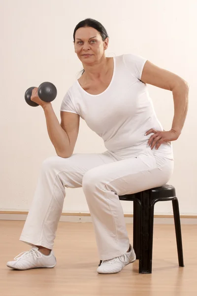 Woman with dumbbell — Stock Photo, Image