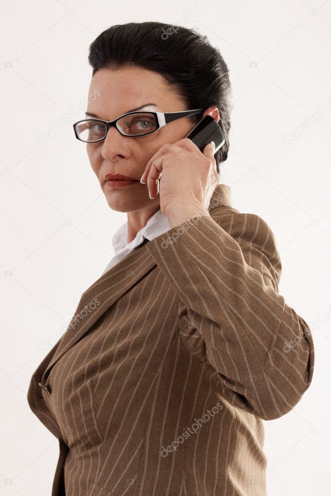 Business woman with glasses when phoning