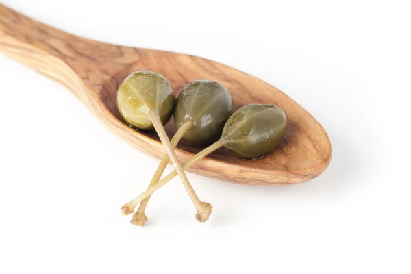 Three Capers in a Wooden Spoon — Stock Photo, Image