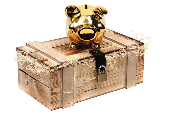 Golden piggybank on wooden case locked with padlock — Stock Photo, Image