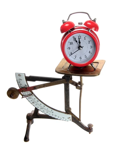 Red alarm bell on old letter scales — Stock Photo, Image