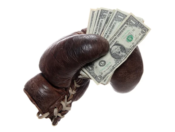 Старая коричневая боксерская перчатка с долларами — стоковое фото