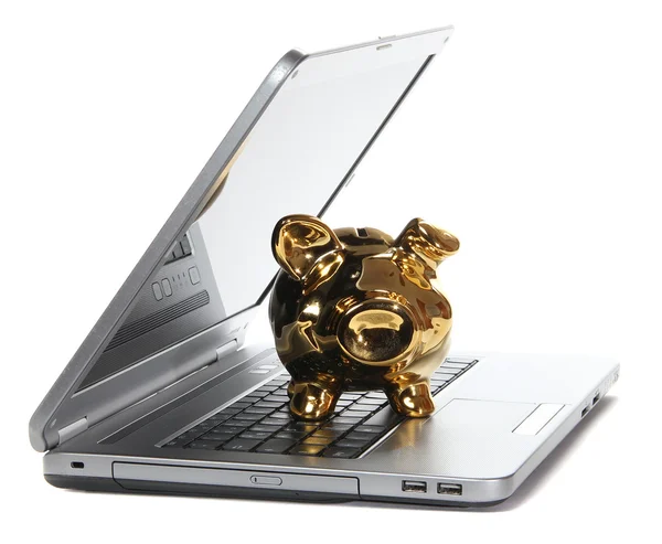 Gouden piggy bank op notebook — Stockfoto