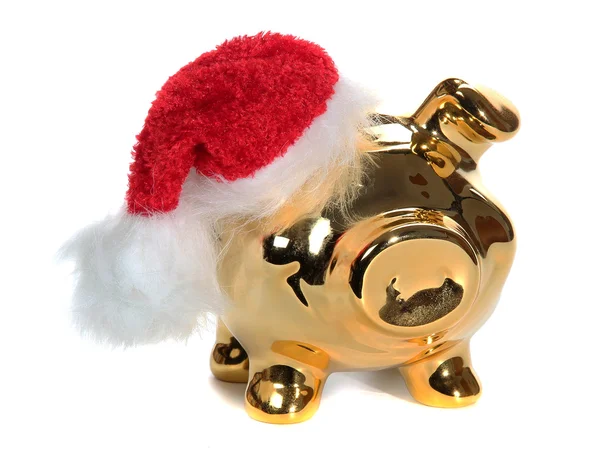 Goldenes Sparschwein mit roter Gummibeutelmütze — Stockfoto