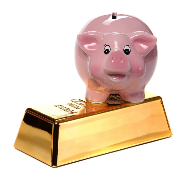 Bullion ouro com banco piggy rosa — Fotografia de Stock