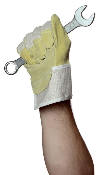 Złota rączka z pracy rękawiczki trzymając klucz śruby — Zdjęcie stockowe