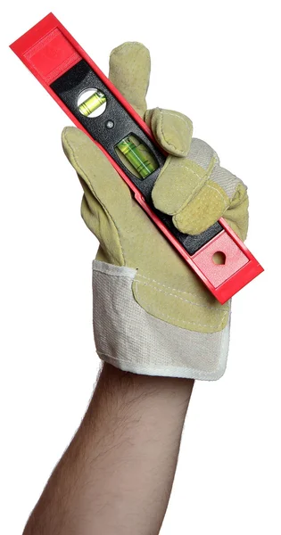 Handyman with work glove holding a level — Stock Photo, Image