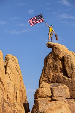 Climber on the summit. clipart