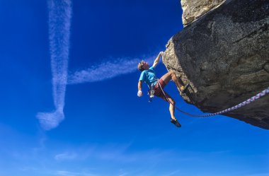 Middle aged male rock climber. clipart