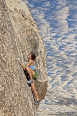 Climber gripping the rock. clipart