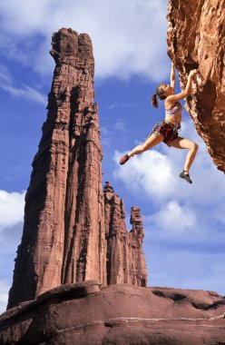 Rock climber dangling. clipart