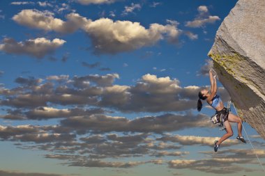 Rock climber dangling. clipart