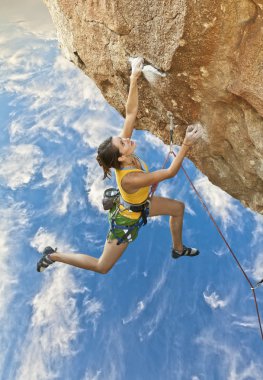 Rock climber dangling. clipart