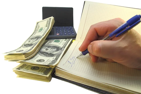 Affärsman räknar pengar på en miniräknare — Stockfoto