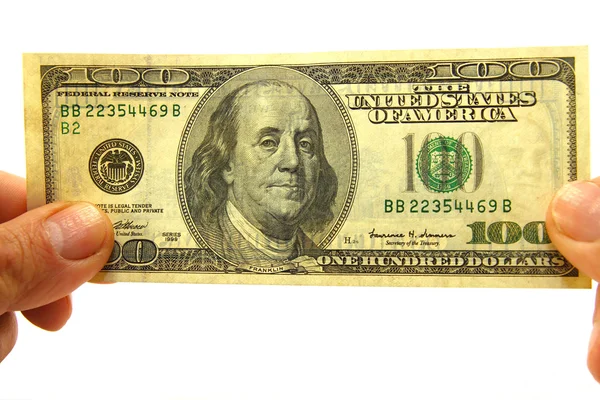 Podnikatel drží 100 dolarové bankovky — Stock fotografie