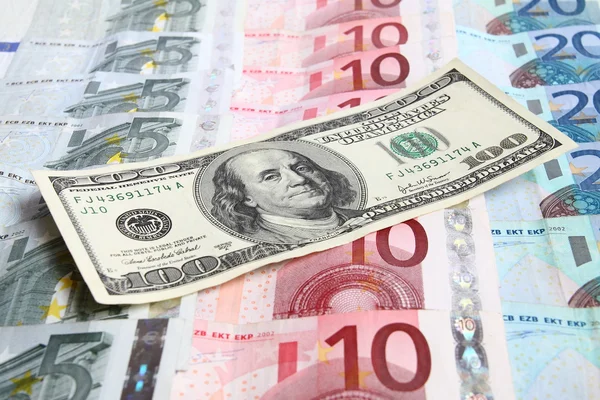 Сто долларов против евро Лицензионные Стоковые Фото