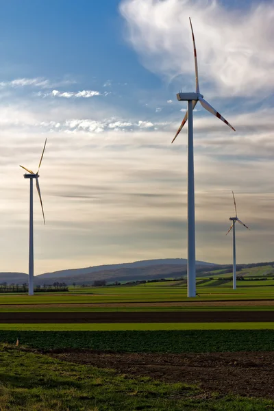 stock image Three wind turbines of wind farm in the field