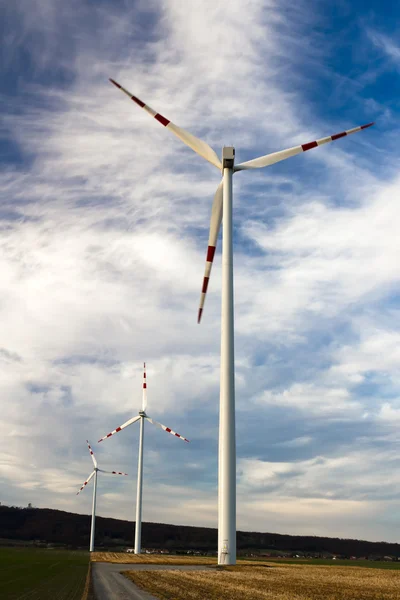 Three wind turbines of the wind farm in a row — Stock Photo, Image
