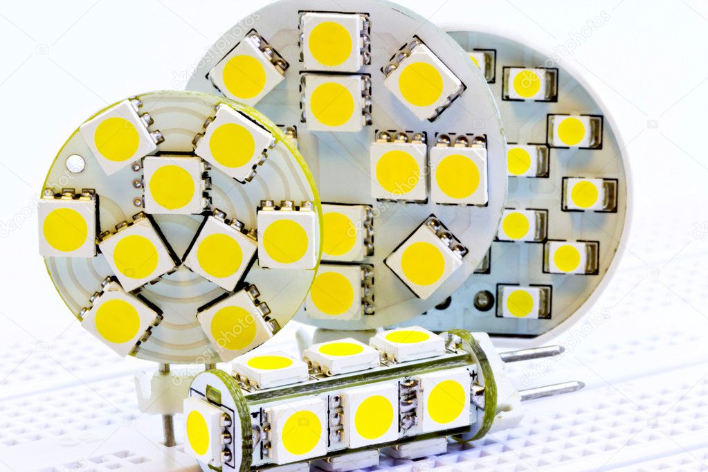 Various G4 LED bulbs on test board